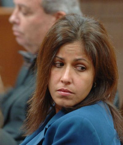 
Patricia Battisti sits in a courtroom in Mineola, N.Y., next to her attorney, Jeffrey S. Lisabeth, on Jan. 19. 
 (Associated Press / The Spokesman-Review)