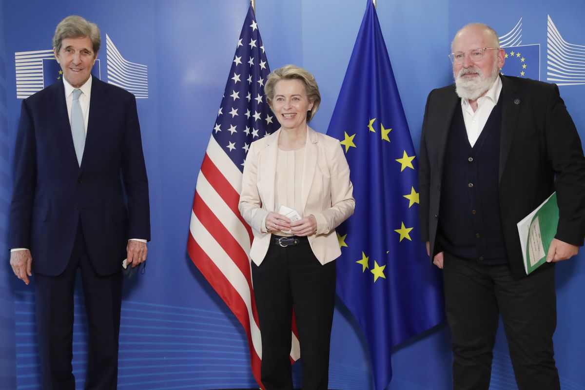FILE - In this March 9, 2021 file photo, United States Special Presidential Envoy for Climate John Kerry, left, European Commission President Ursula von der Leyen, center, and European Commissioner for European Green Deal Frans Timmermans pose for photographers prior to a meeting at EU headquarters in Brussels. The European Union reached a tentative climate deal on Wednesday, April 21, 2021 that should make the 27-nation bloc climate-neutral by 2050, with member states and parliament agreeing on the targets on the eve of a virtual summit that U.S. President Biden will host.  (Olivier Hoslet)
