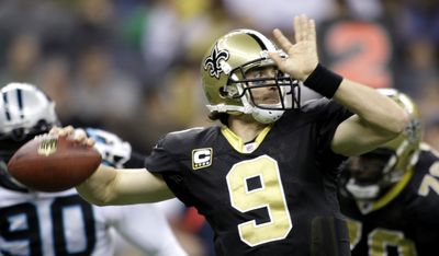 Drew Brees is the second player to pass for more than 5,00 yards in a season. (Associated Press / The Spokesman-Review)