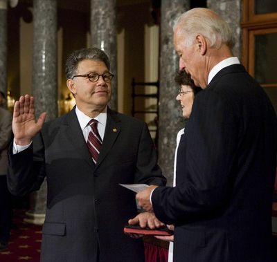 Sen. Al Franken, D-Minn.,  with his wife, Franni, holding the Bible, is sworn into office  by Vice President Joe Biden on Capitol Hill on Tuesday.  (Associated Press / The Spokesman-Review)