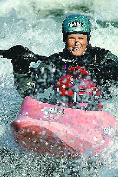 
Devon Barker surfs Spokane's Corbin Park swells.
 (The Spokesman-Review)