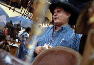 
Bob Hickman, of Hickman Saddlery in Post Falls, sells new and antique saddles, spurs and chaps at the Northwest Soiree on Saturday.  
 (Holly Pickett / The Spokesman-Review)