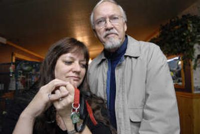 
Marcia and Rich Graham from near Marshall, Wash., lost their dog Harlee, a 2 year-old Pomeranian, in July. The dog was later adopted out by SpokAnimal C.A.R.E. to a new owner who refuses to return the dog. Marcia, holding Harlee's collar and leash, carries them in her car in hope of getting her dog back. 
 (Dan Pelle / The Spokesman-Review)