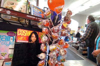 
Copies of Cosmopolitan are partially covered at the checkout counter of Super 1 Foods in Hayden.  
 (Jesse Tinsley / The Spokesman-Review)