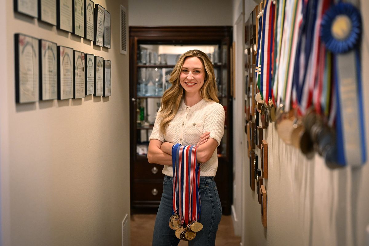 Amanda (Furrer) Banta poses for a photo with some of the many awards she won on her way to becoming a shooter on the 2012 U.S. Olympic team.  (Tyler Tjomsland/The Spokesman-Review)