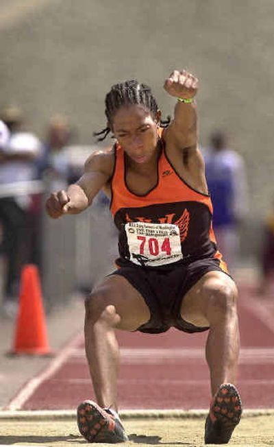 
West Valley's Rashaad Toussaint landed in the Spokane triple-jump record book on Saturday. West Valley's Rashaad Toussaint landed in the Spokane triple-jump record book on Saturday. 
 (Rajah Bose/Rajah Bose/ / The Spokesman-Review)