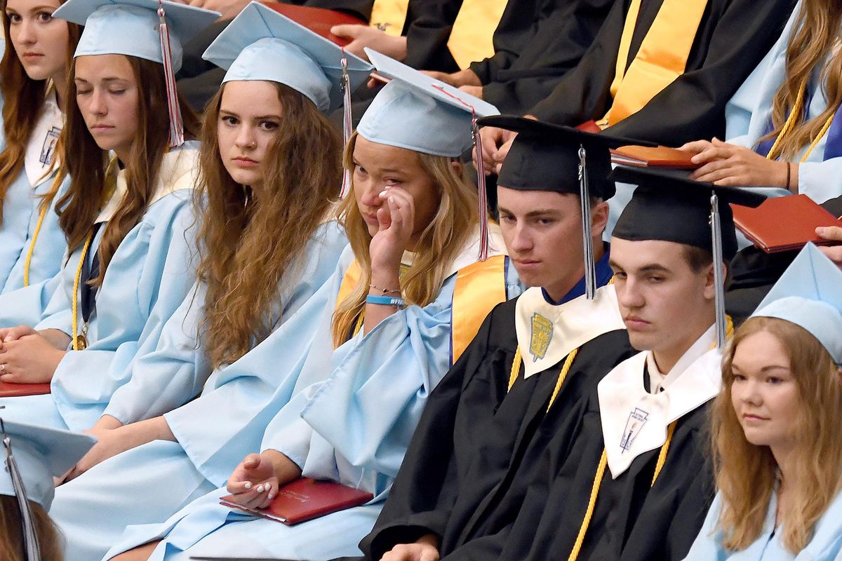 Freeman High School senior Ailisa Hansen wipes a tear away during graduation at the school on Saturday, June 9, 2018. (Kathy Plonka / The Spokesman-Review)