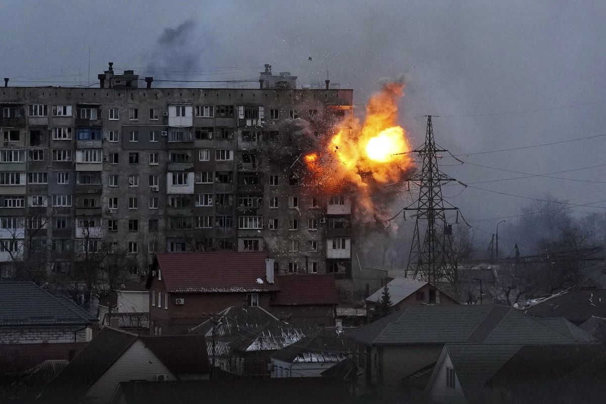 FILE - An explosion is seen in an apartment building after Russian