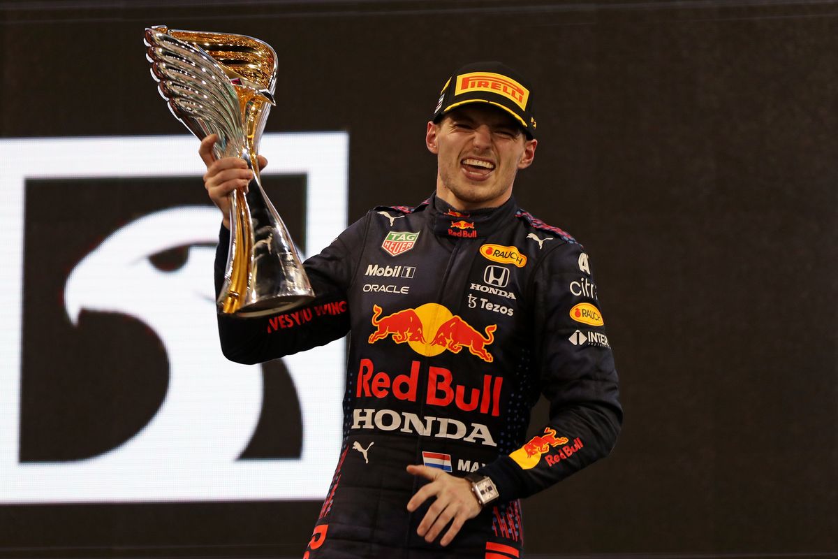 Red Bull driver Max Verstappen of the Netherlands celebrates on the podium after becoming F1 drivers world champion after winning the Formula One Abu Dhabi Grand Prix in Abu Dhabi, United Arab Emirates, Sunday, Dec. 12. 2021.  (Associated Press)