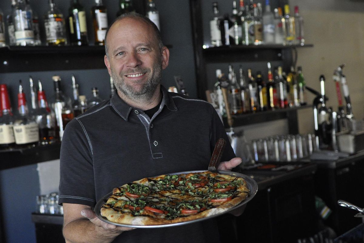 John Siok is the new owner of Pacific Pizza in Browne’s Addition. He took over the business, formerly Pacific Avenue Pizza, in August. He also owns South Perry Pizza in Spokane’s South Perry neighborhood. (Adriana Janovich / The Spokesman-Review)