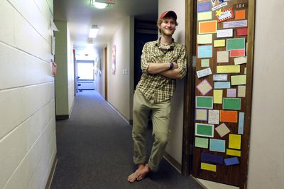 Jordan Michaelson stands outside his residence hall room Monday at Whitworth University, where he serves as a resident assistant and mentor to other college students. Michaelson is a junior studying education. He said he thinks  his work at his church and his youth group helped him get the job.  (Jesse Tinsley / The Spokesman-Review)