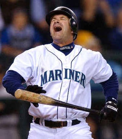 
Seattle's Edgar Martinez reacts to a called third strike on a 3-2 count with the bases loaded in the seventh inning against Baltimore.Seattle's Edgar Martinez reacts to a called third strike on a 3-2 count with the bases loaded in the seventh inning against Baltimore.
 (Associated PressAssociated Press / The Spokesman-Review)