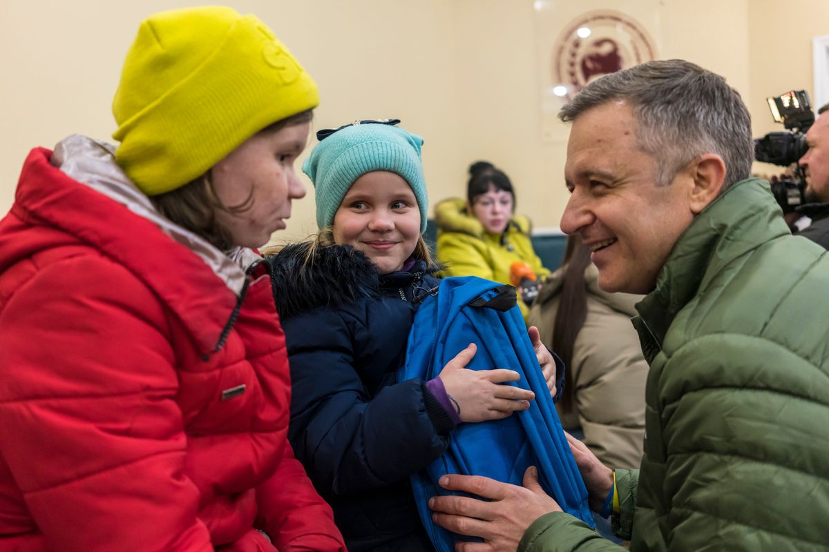 Veronika Tsymbolar, and her daughter, Marharyta Matiunina, who had been missing before the group Save Ukraine located her in Feodosiya, a resort town in Crimea, speak with Mykola Kuleba, the CEO of Save Ukraine, at a welcome reception in Kyiv, Ukraine on Feb. 2, 2023. Tsymbolar believes her daughter