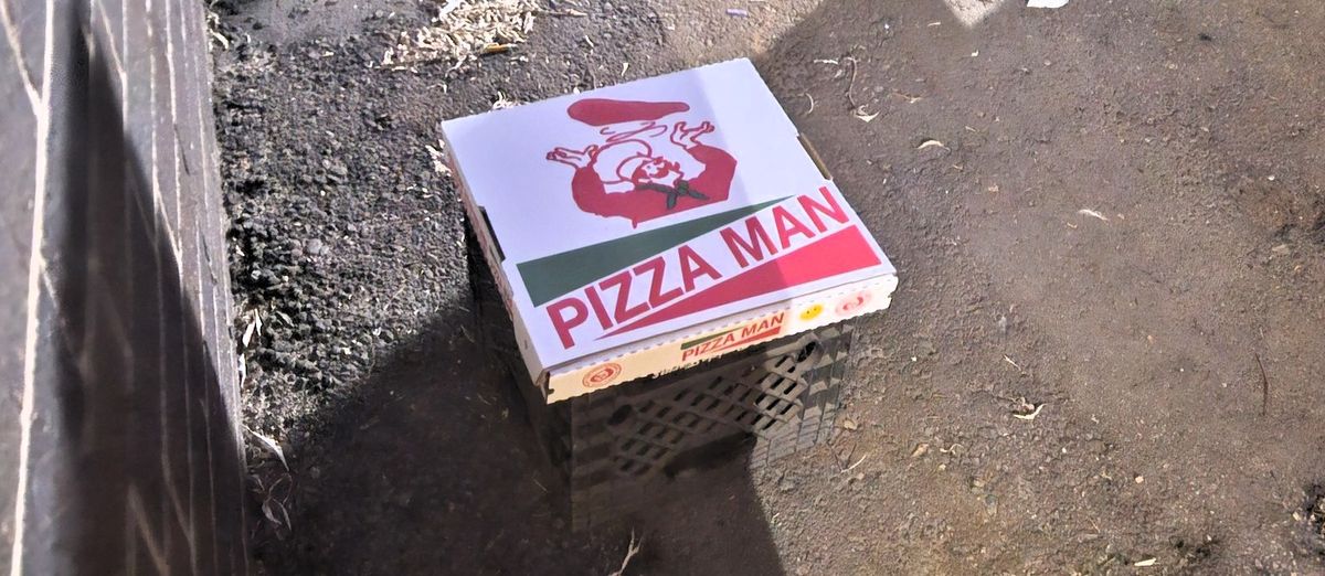 Pizza Man said it left a box of cheese pizza behind its store in Columbia Heights, Minnesota, on July 29 for someone who was taking leftovers from the dumpster. MUST CREDIT: Pizza Man 
