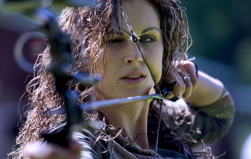 Amanda Lowrey of Sandpoint, while competing in the Extreme Huntress TV reality series, practices archery in her North Idaho backyard. (Kathy Plonka)
