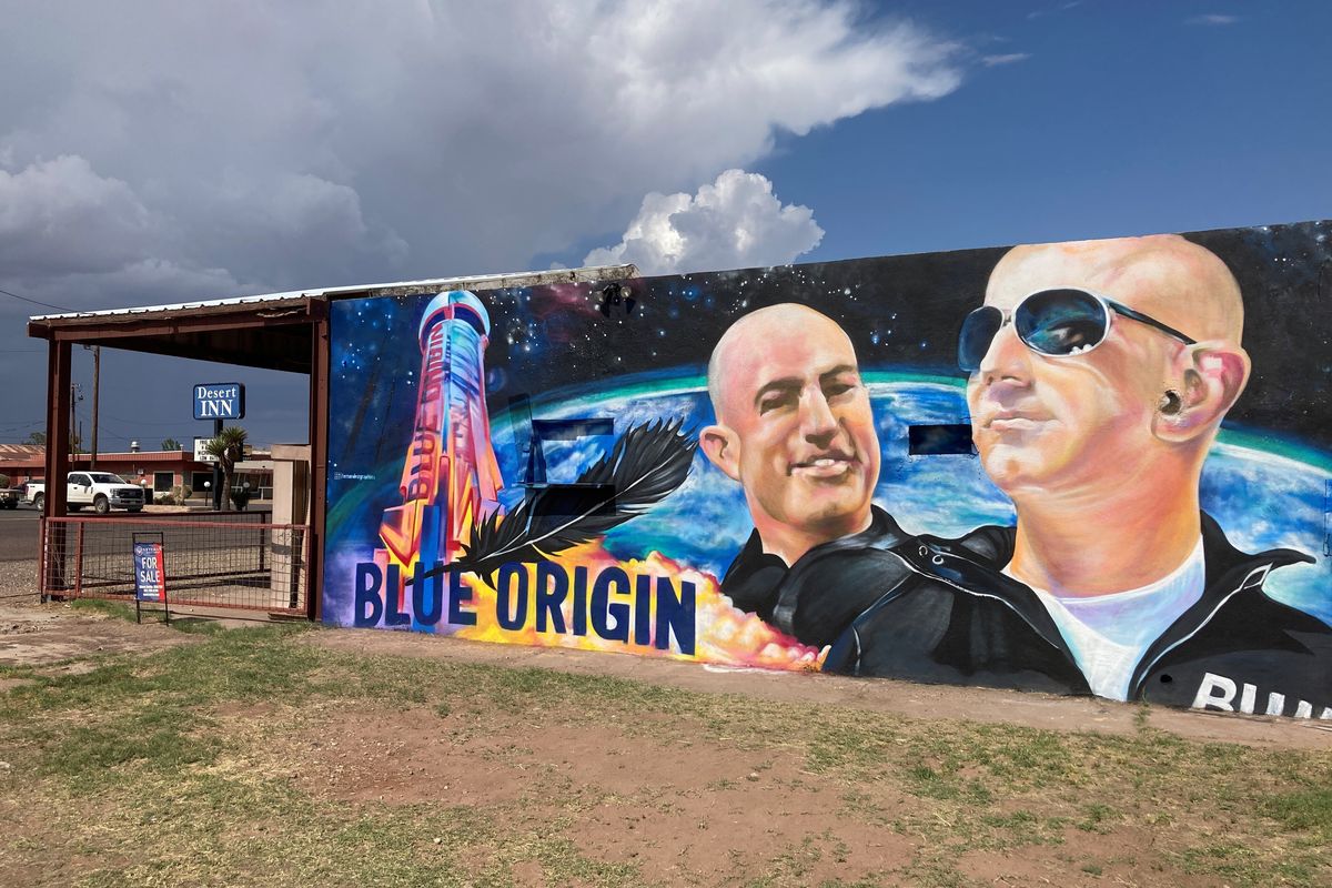 The side of a building in Van Horn, Texas, is adorned with a mural of Blue Origin founder Jeff Bezos, who plans to launch into space Tuesday.  (Sean Murphy)