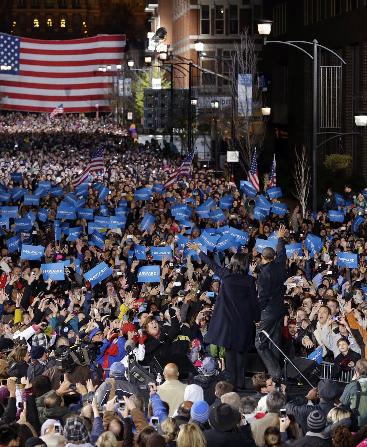 President Barack Obama and first lady Michelle Obama on stage together during his final 2012 campaign event in downtown Des Moines, Iowa, Monday, Nov. 5, 2012. (Pablo Monsivais / Associated Press)