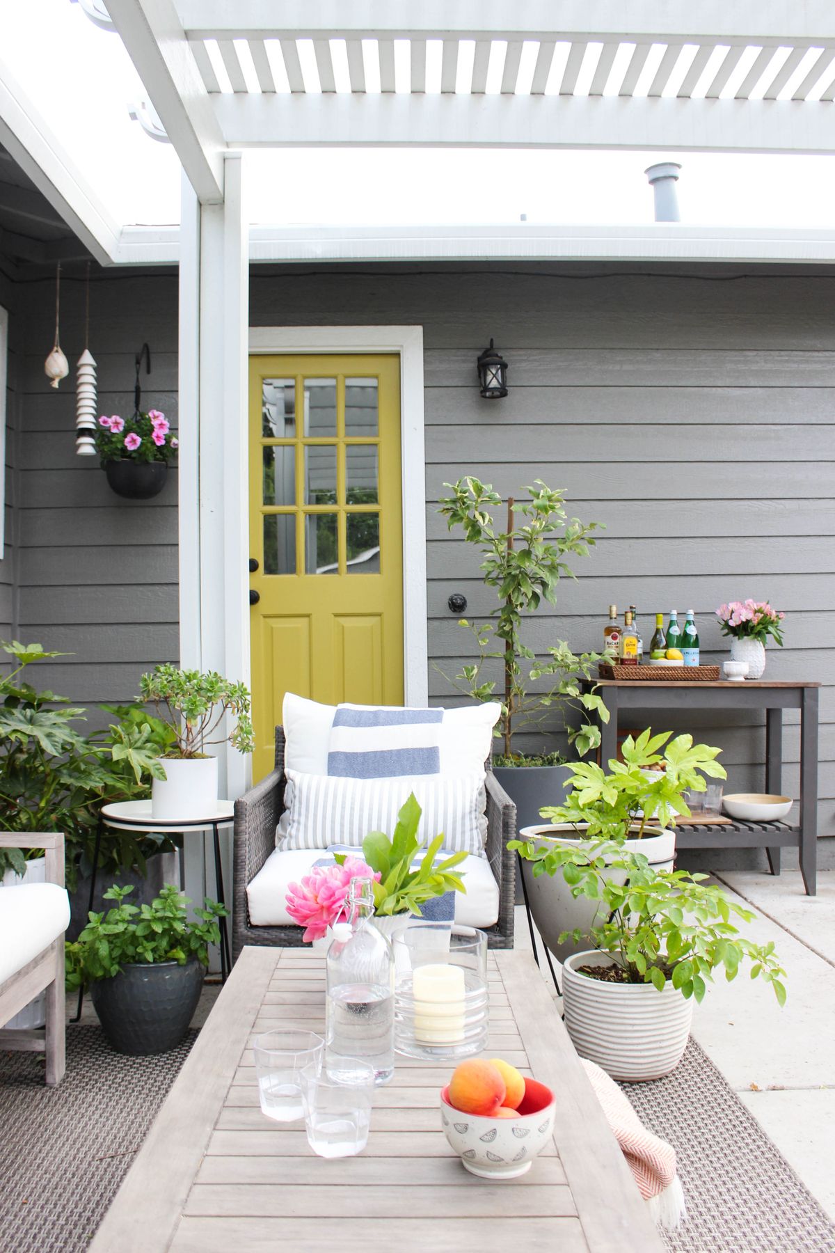 If you have a door that opens out to an outdoor space, design blogger Katrina Blair suggests painting it a bright color, like her chartreuse door.  (Katrina Blair)