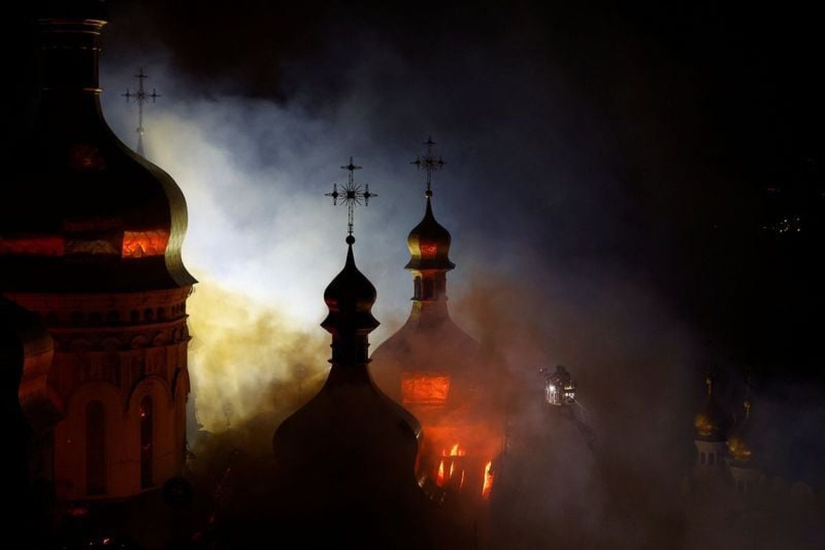 The Dormition Cathedral of the Kyiv Pechersk Lavra burns Monday after it was hit during Russian missile and drone strikes in Kyiv, Ukraine.  (Reuters )