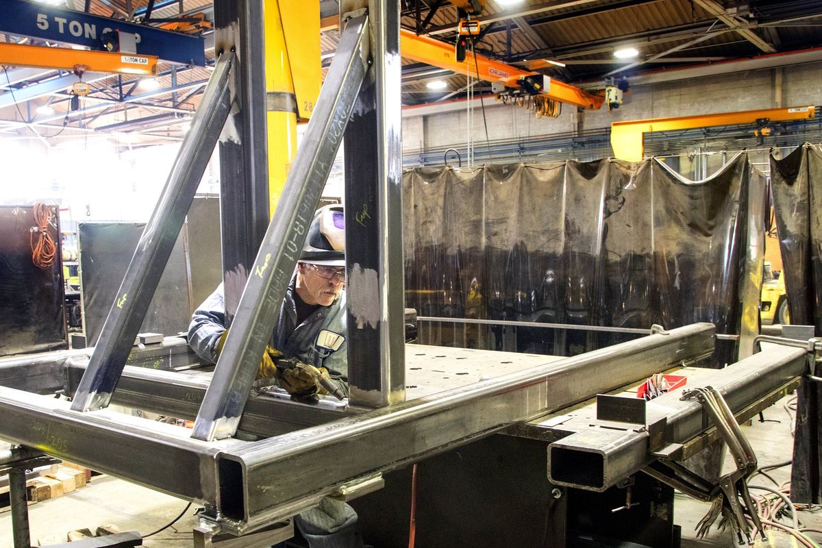Machinist Bill Gaut prepares to weld a tool that positions 737 thrust reversers at Boeing's Renton factory in 2018. The Machinists union is is in critical contract talks with Boeing this year.    (Mike Siegel/The Seattle Times/TNS)