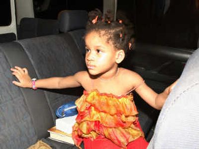 
Margaret Hill, 3, sits in a car after  her release by kidnappers in Port Harcourt, Nigeria, on Sunday. Associated Press
 (Associated Press / The Spokesman-Review)