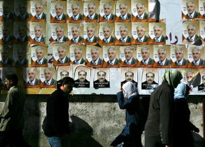 
Election posters coat Ramallah in the West Bank, but Israel is reluctant to allow East Jerusalem residents to vote. 
 (Associated Press / The Spokesman-Review)