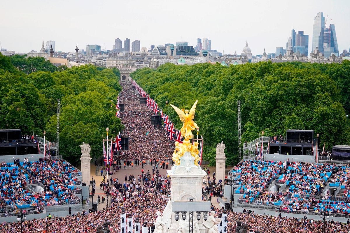 Crowds on the Mall watch the Platinum Jubilee concert, taking place in front of Buckingham Palace, London, Saturday June 4, 2022, on the third of four days of celebrations to mark the Platinum Jubilee. The events over a long holiday weekend in the U.K. are meant to celebrate Queen Elizabeth II’s 70 years of service.  (Niklas Halle