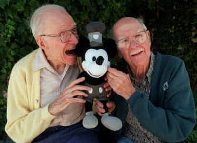 
Frank Thomas, left, is shown with Ollie Johnston, another of Walt Disney's original animators, in 1999 in Los Angeles with a Mickey Mouse doll. 
 (Associated Press / The Spokesman-Review)