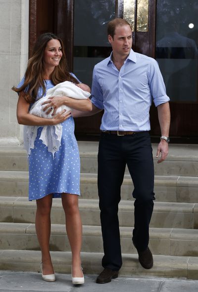 Britain's Prince William and Kate, Duchess of Cambridge, hold the Prince of Cambridge, Tuesday July 23, 2013, as they pose for photographers outside St. Mary's Hospital exclusive Lindo Wing in London where the Duchess gave birth on Monday, July 22. The royal couple are expected to head to London's Kensington Palace from the hospital with their newly born son, the third in line to the British throne. (Lefteris Pitarakis / Associated Press)