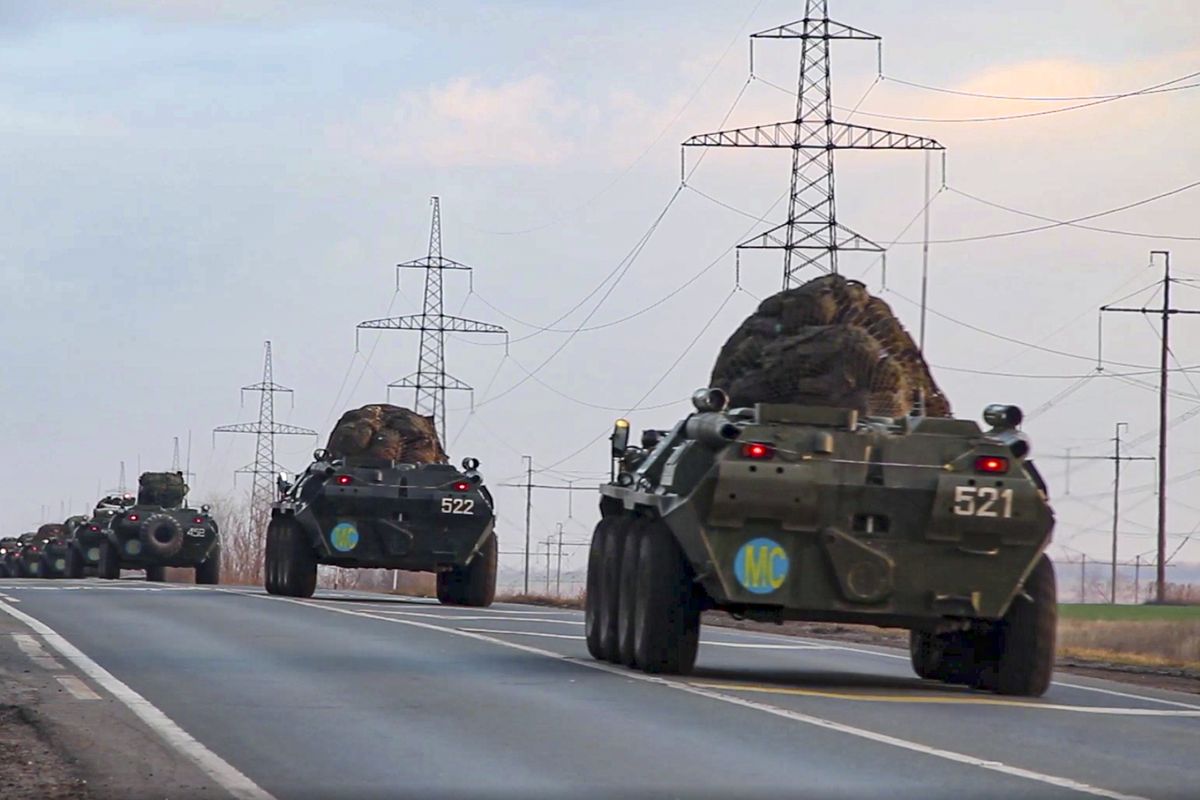 This photo made from the footage provided by Russian Defense Ministry press service on in Tuesday, Nov. 10, 2020 shows Russian military vehicles carry peacekeepers on their way to an airport in unknown place in Russia. Scores of Russian peacekeepers were heading to Nagorno-Karabakh on Tuesday morning, hours after Armenia and Azerbaijan agreed to halt the fighting over the separatist region in a pact signed with Moscow which envisions the deployment of nearly 2,000 Russian peacekeepers and territorial concessions.  (HOGP)