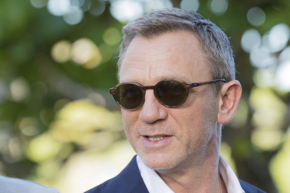 In this Thursday, Apriil 25, 2019 photo, actor Daniel Craig poses for photographers during the photo call of the latest installment of the James Bond film franchise, in Oracabessa, Jamaica. Producers of the forthcoming James Bond thriller say the film