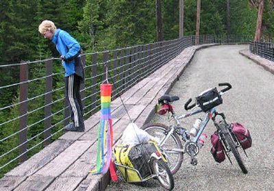 
Amy Hood, 17, of Edmonds, Wash., looks over the side of a towering train trestle on her 2004 bike trip. 
 (Courtesy of Ron Hood / The Spokesman-Review)