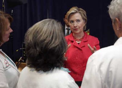 
Presidential candidate Sen. Hillary Rodham Clinton, D-N.Y., talks Thursday with doctors at Dartmouth-Hitchcock Medical Center in Lebanon, N.H.Associated Press photos
 (Associated Press photos / The Spokesman-Review)