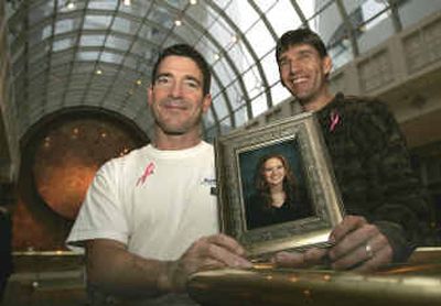 
Double-lung transplant recipient Len Geiger, left, of Gainesville, Ga., and Kevin Shroyer, right, of Lynchburg, Va., hold a photo of Korinne Shroyer, Kevin Shroyer's late daughter, in downtown Richmond, Va., on Friday. Geiger and Shroyer ran the SunTrust Richmond (Va.) Marathon on Saturday. Geiger was the recipient of Korinne Shroyer's lungs in 2002. 
 (Associated Press / The Spokesman-Review)