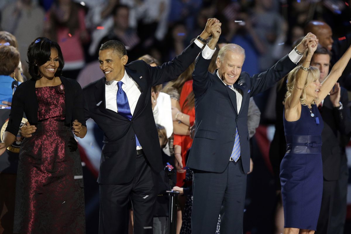 President Barack Obama, first lady Michelle Obama, Vice President Joe Biden and Jill Biden wave at the president’s election night party early this morning in Chicago. (Associated Press)