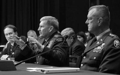 
Army Gen. Peter Schoomaker, center, flanked by Army Surgeon General Lt. Gen. Kevin Kiley, right, and Assistant Defense Secretary William Winkenwerder Jr., testifies Tuesday on Capitol Hill. 
 (Associated Press photos / The Spokesman-Review)