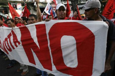 
Protesters rally  against canal expansion in Panama City, Panama, Friday. Panamanians will vote on an eight-year, $5.2 billion expansion plan in a referendum today. 
 (Associated Press / The Spokesman-Review)