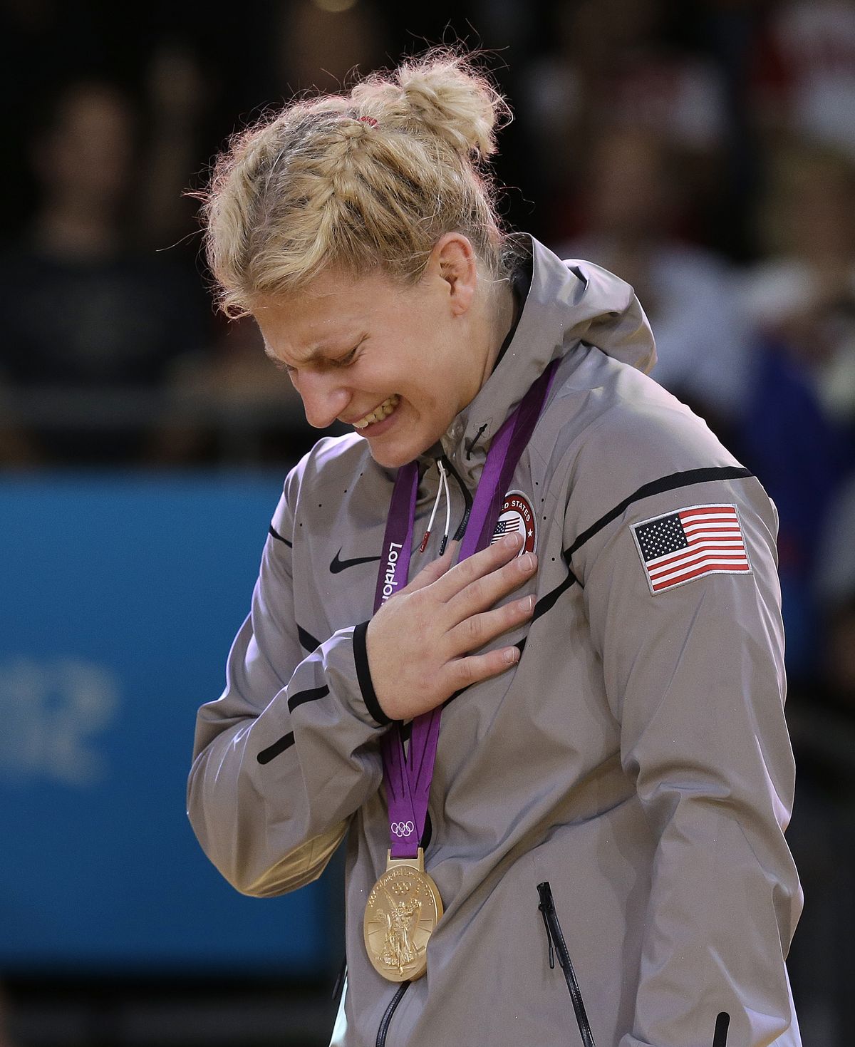 Kayla Harrison of the U.S. weeps during the national anthem after winning gold in the 78-kg judo competition. (Associated Press)