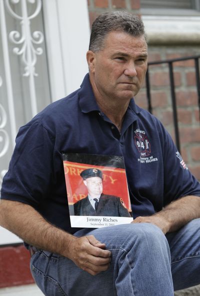 Jim Riches poses with a photo of his son, who was killed during the Sept. 11 attacks, near his home in New York on Thursday. Riches will be watching the arraignment of Khalid Sheikh Mohammed on closed-circuit TV at New York’s Fort Hamilton. (Associated Press)
