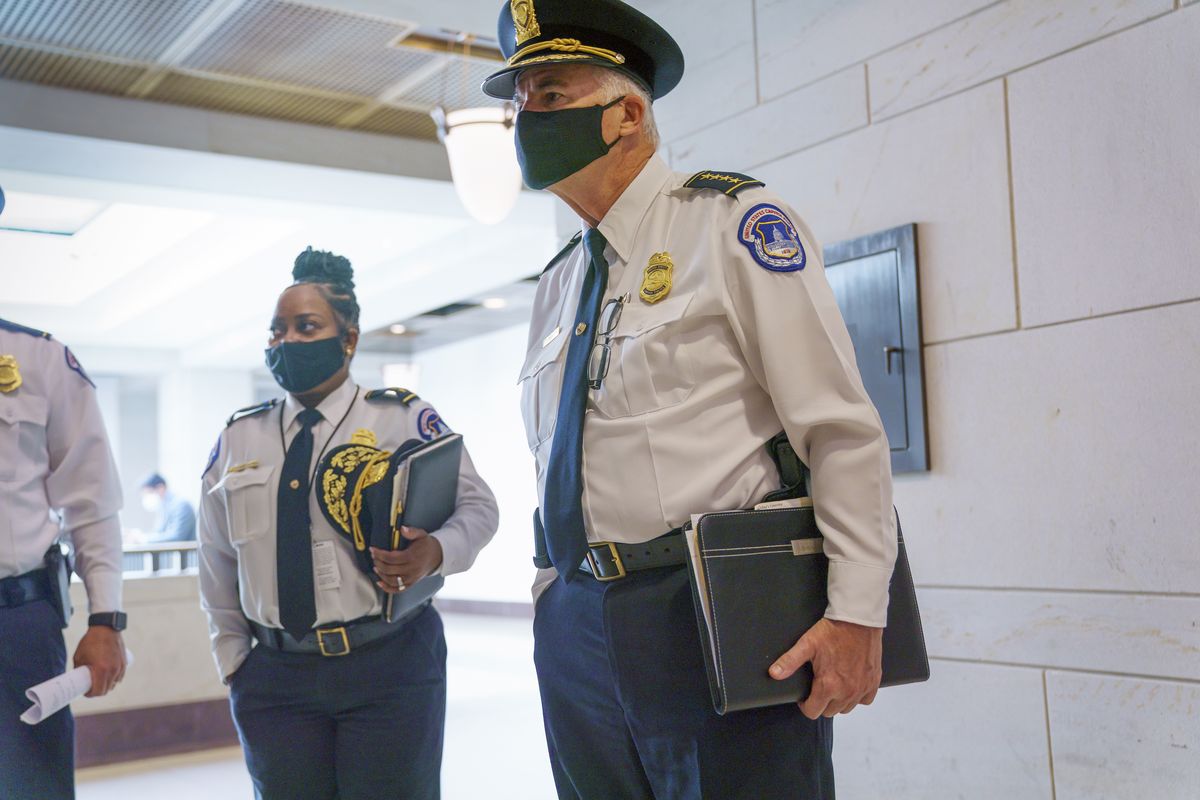 U.S. Capitol Police Chief Thomas Manger, joined at left by Assistant Chief Yogananda Pittman, heads to a closed-door meeting with congressional leaders for a briefing as security officials prepare for a Sept. 18 demonstration by supporters of the people arrested in the Jan. 6 riot, at the Capitol in Washington, Monday, Sept. 13, 2021.  (J. Scott Applewhite)