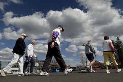 
Bloomsday participant Bob Wilson, 90, center, of Rockwood Retirement Communities, embarks on a five-mile walk with other residents and staff Tuesday afternoon. 
 (Brian Plonka / The Spokesman-Review)