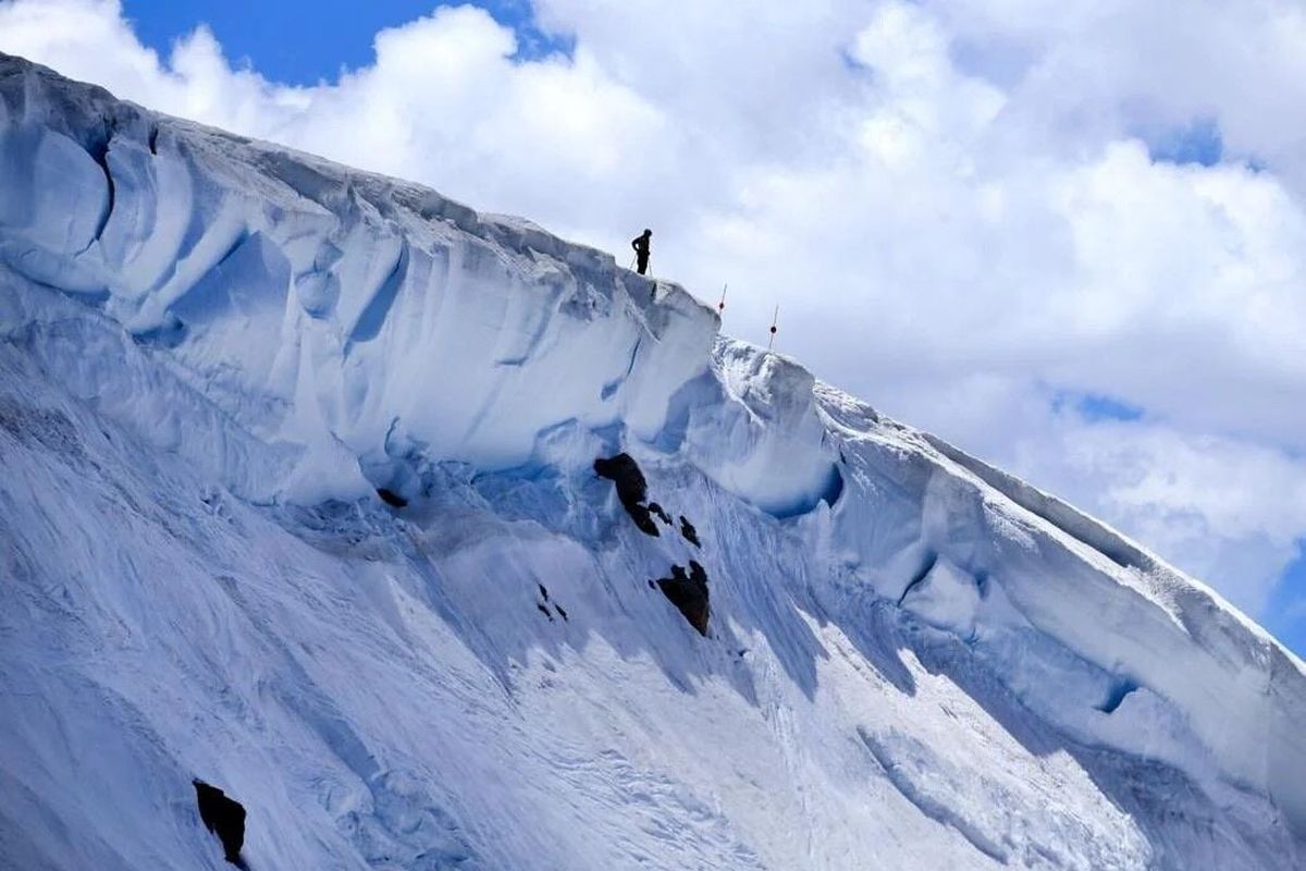 A skier stands on top of a cornice at Beartooth Basin Summer Ski Area on in 2017. At the time, it had been three years since the area was open for skiers.  (Billings Gazette)