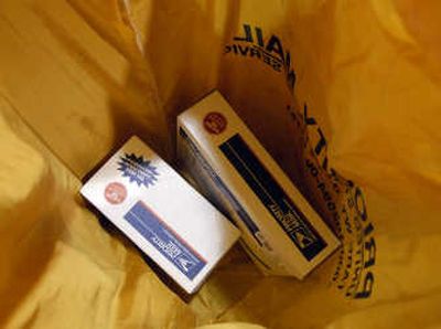 
Packages at the U.S. Postal Service wait to be shipped to troops abroad. 
 (Dan Pelle / The Spokesman-Review)