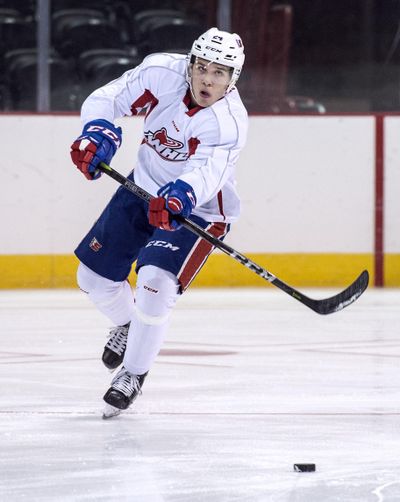 Spokane Chiefs Ty Smith passes to a teammate during practice, Wed., Sept. 20, 2017, in the Spokane Arena. (Dan Pelle / The Spokesman-Review)