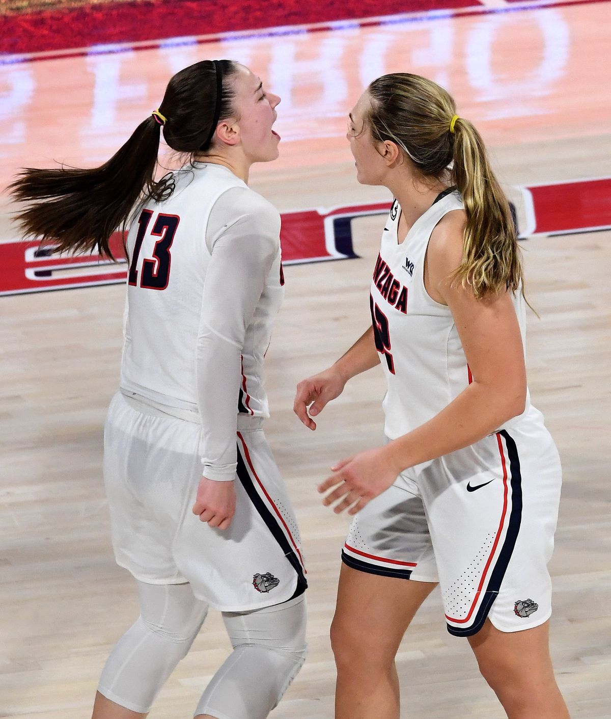 Gonzaga guard Cierra Walker (13) celebrates after hitting one of her two late 3-pointers to help the 19th-ranked Bulldogs hold off BYU 63-56 in West Coast Conference play Tuesday at McCarthey Athletic Center.  (Colin Mulvany/The Spokesman-Review)