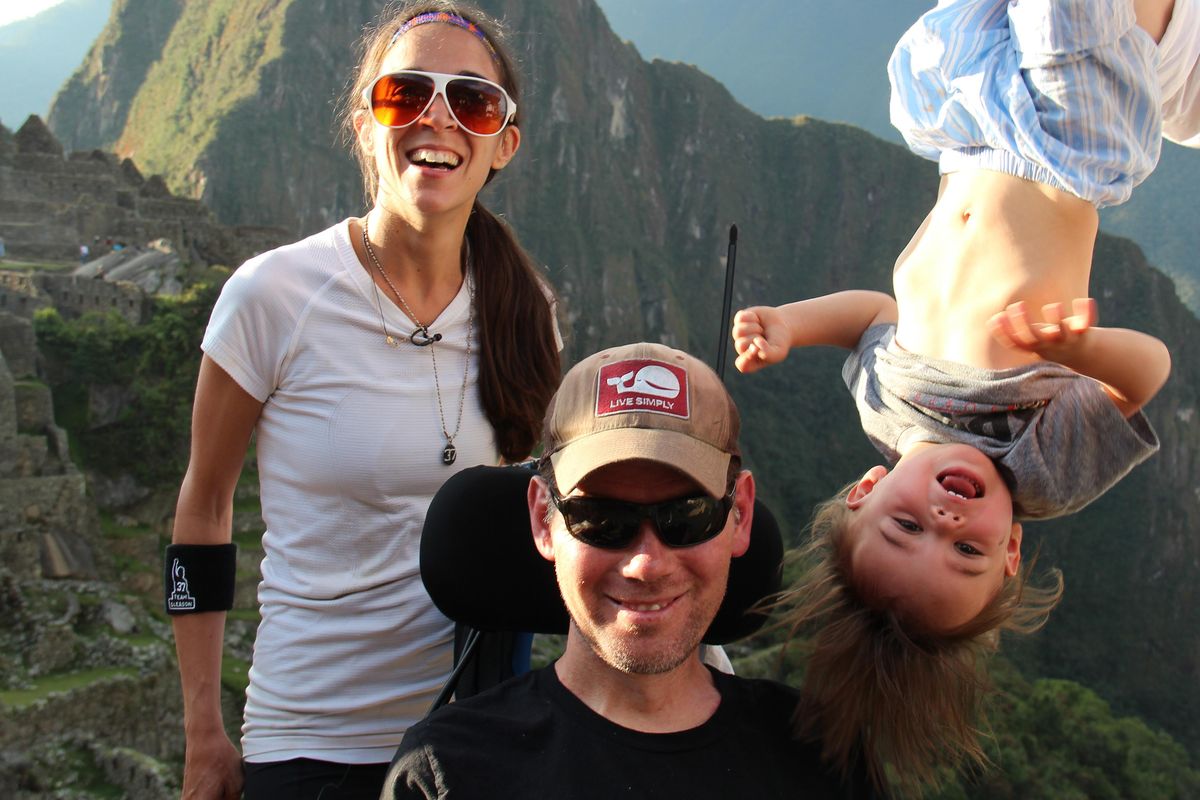 In this image released by Open Road Films, former New Orleans Saints safety Steve Gleason, left, appears with his son Rivers, right, and wife Michel in a scene from the documentary “Gleason.” The film follows Gleason and his wife, Michel, into the maelstrom of ALS, or Lou Gehrigs disease, as the couple adjusts to their fluctuating reality and makes way for their son, Rivers. (Open Road Films via AP)