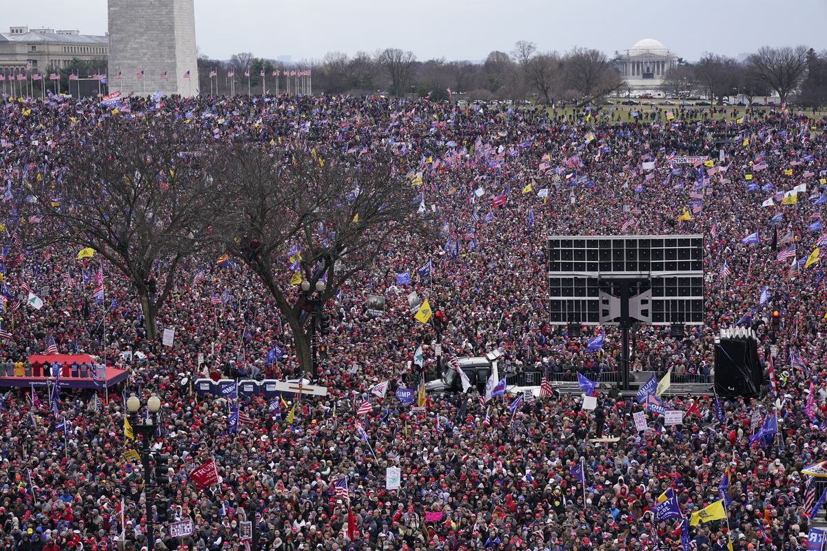 With the Washington Monument in the background, people attend a rally in support of President Donald Trump near the White House on Wednesday, Jan. 6, 2021, in Washington.  (Jacquelyn Martin)