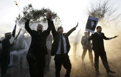 
Pakistani lawyers brave water canon bursts as they try to visit the home of deposed Chief Justice Iftikhar Muhammad Chaudhry during his house arrest in Islamabad on Saturday. Associated Press
 (Associated Press / The Spokesman-Review)