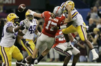 
LSU linebacker Ali Highsmith (7) knocks the ball from Ohio State quarterback Todd Boeckman (17) causing a fumble that LSU recovered. Associated Press
 (Associated Press / The Spokesman-Review)