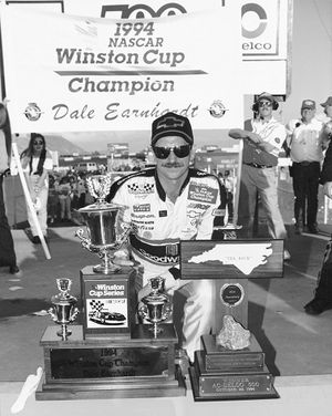 Dale Earnhardt celebrates his seventh NASCAR Winston Cup championship. (Photo courtesy of NASCAR)